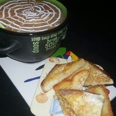 Chicken creamy soup with chilli toast A picture of Chicken creamy soup with chilli toast.