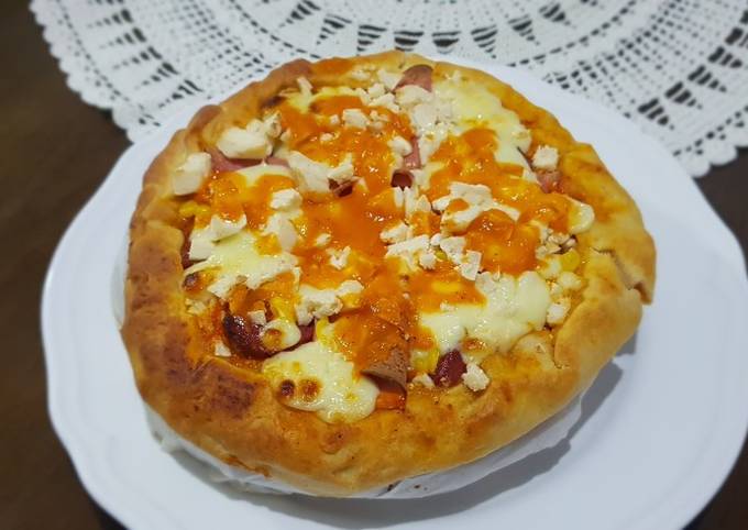 Pizza covered with homemade Mozzarella Cheese & Sausage