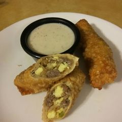 A picture of Breakfast Eggrolls with Pepper Gravy.