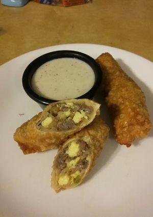 A picture of Breakfast Eggrolls with Pepper Gravy.