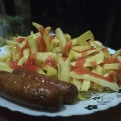 A picture of Fries and sausages.