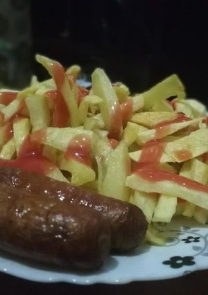 A picture of Fries and sausages.