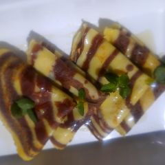 A picture of Marble pancakes with maple syrup.