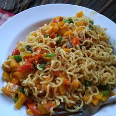A picture of Stir fry Noodles with veggies.