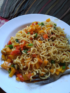 A picture of Stir fry Noodles with veggies.
