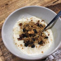 A picture of OatMilk Porridge with Granola.