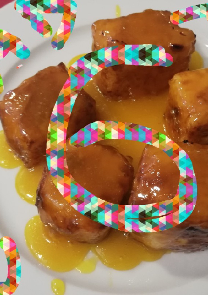 Una foto de Leche frita flambeada