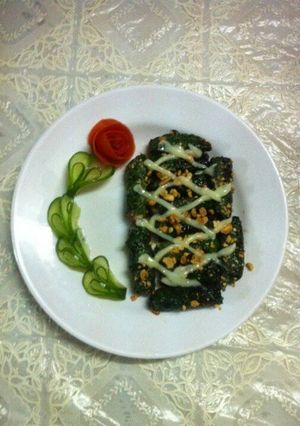 A picture of Grilled Beef Wrapped in Betel Leaves (Bò nướng lá lốt).