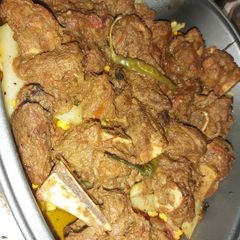 A picture of Mutton with steam veggies.