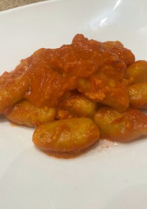 A picture of Pumpkin Gnocchi with Bacon and Cherry Tomato Cream.