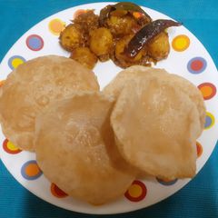 A picture of Bengali Alur Dom With Luchi (veg sabzi and luchi).