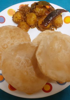 A picture of Bengali Alur Dom With Luchi (veg sabzi and luchi).