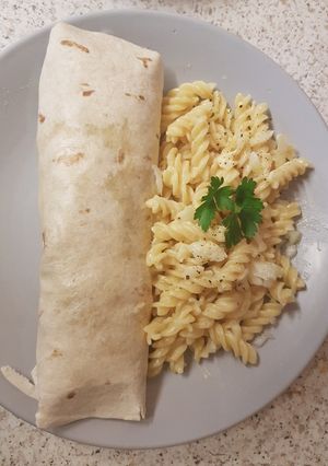 A picture of My tasty Chicken & Bacon Wrap with cheesy #Pasta.