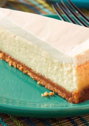 A picture of Cheesecake with Sour Cream Topping.
