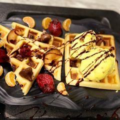A picture of Waffle 🧇 With Butter Scoth Ice cream🍦.