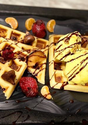A picture of Waffle 🧇 With Butter Scoth Ice cream🍦.