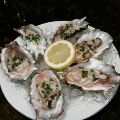 A picture of Brad's oysters with champagne lemon mignonette.