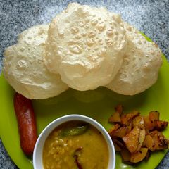 Luchi, cholar daal, aloo bhaja A picture of Luchi, cholar daal, aloo bhaja.