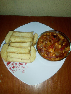 A picture of Fried yam and baked beans sauce.