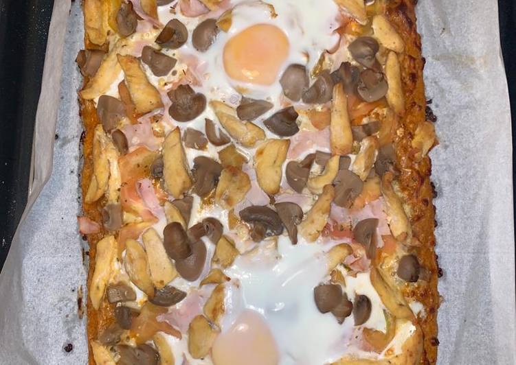 Pizza integral con pollo y más cosas