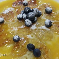 A picture of Pancake with orange sauce.