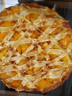 Una foto de Kuchen de durazno🍑🍑