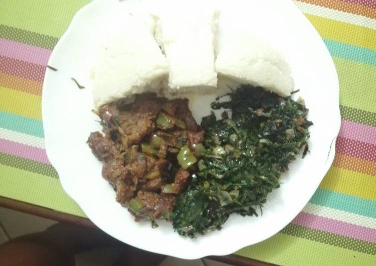 Ugali, steamed greens, beef stew