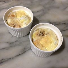 A picture of Baked Eggs with Spinach and Parmesan.