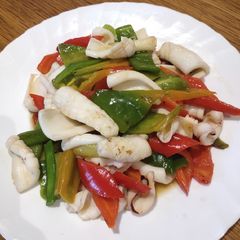 A picture of Squid with Red and Green Chillies.