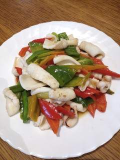 A picture of Squid with Red and Green Chillies.