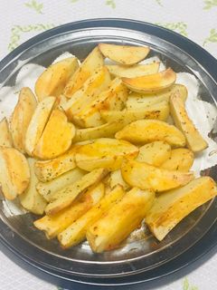 Una foto de Papas al horno con finas hierbas!