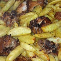 A picture of Oven potato Wedges and chicken.