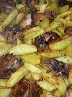A picture of Oven potato Wedges and chicken.