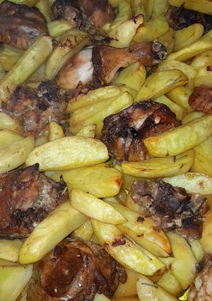 A picture of Oven potato Wedges and chicken.