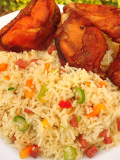 A picture of Stirred fried rice and fried chicken.