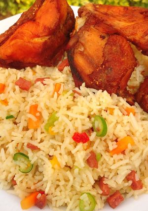 A picture of Stirred fried rice and fried chicken.