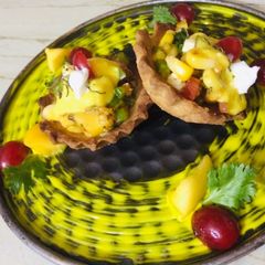 A picture of Mango salsa tart.