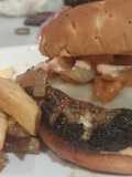 Beef, Lamb and Feta Burger with Provolone, Caramelized Onions and Russian Horseradish Dressing served with Garlic Fries