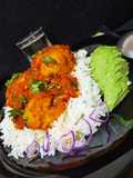 Green bananas(matoke) balls served with rice