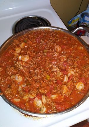 A picture of Shrimp and italian sausage spaghetti.