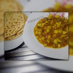 A picture of Potatoe and minced meat sauce.