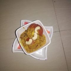 A picture of Stuffed tomato curry.
