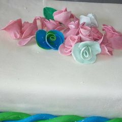 A picture of Fruit cake with fondant icing.