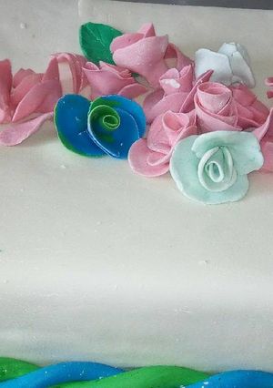 A picture of Fruit cake with fondant icing.