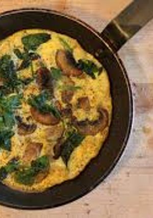 A picture of Spinach and portabello mushroom omlette.