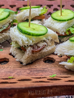 A picture of One bite Chicken & Cucumber Sandwiches.