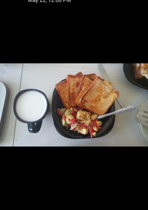 A picture of Toasted bread with kachumbari served with white coffee.