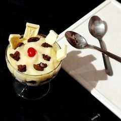 A picture of Dark Chocolate Cookies And Milkybar Mousse.