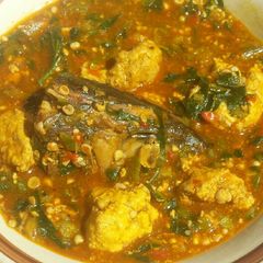 A picture of Lumps of egusi in okra and ogbono soup.