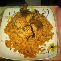 A picture of Jollof rice with smoked fish.